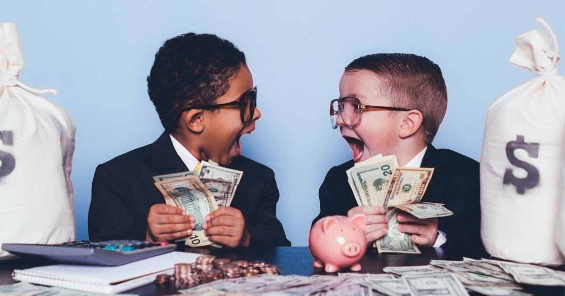Two kids holding money and staring at each other